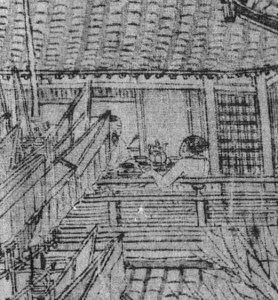 A woman in the hotel and her customer with a bottle of wine on the table