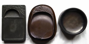 Ink stones of different shapes. Most artists prefer using the round one as the ink can accumulate in the middle.